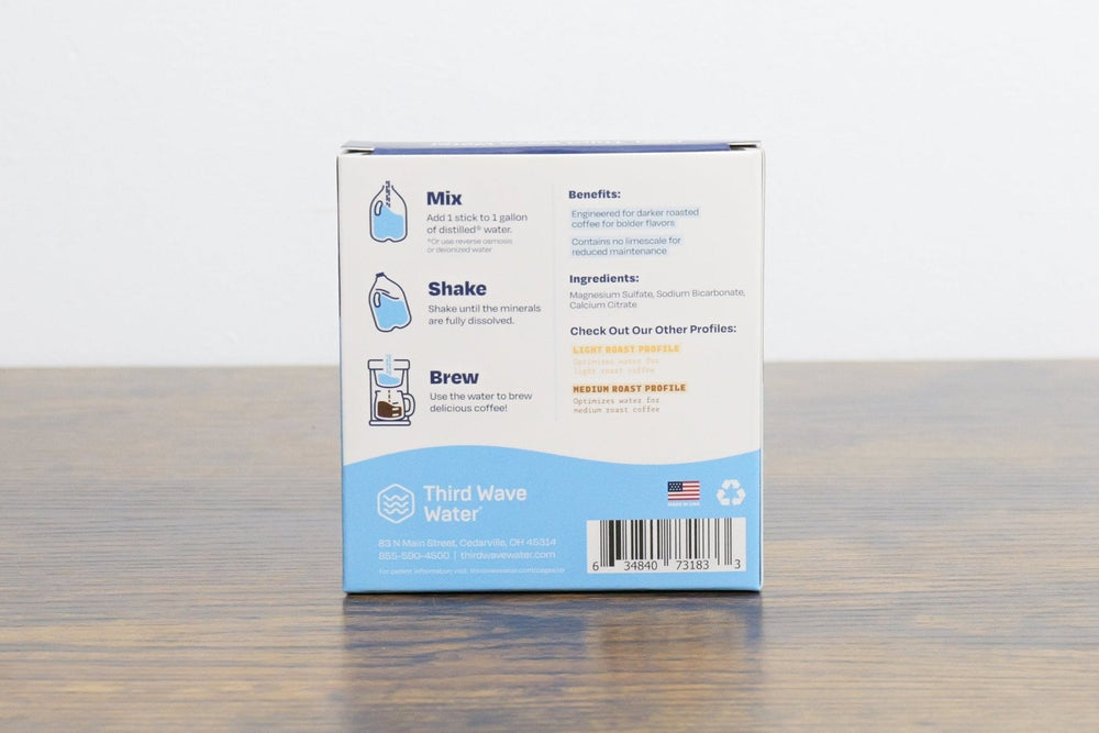 Third Wave Water packaging on a wooden surface with a white background