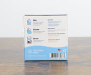Third Wave Water packaging on a wooden surface with a white background