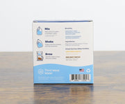 Box of Third Wave Water on a wooden surface with a white background
