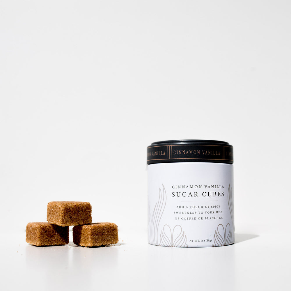 Cinnamon vanilla sugar cubes with packaging on a white background
